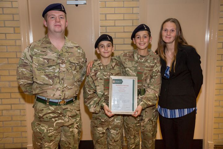 Connor (second from left) with big brother Jack Smith (third from left) and their mum (right).