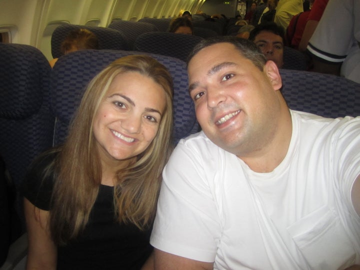 Kimberly Rex and her husband, Anthony, on the plane to meet their older daughter.