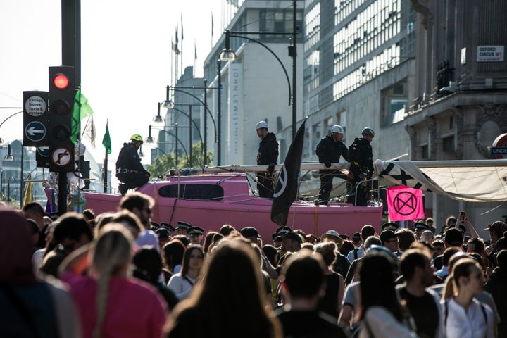 Policeman preparing the boat "Berta Caceres" to remove it from Oxford Circus during the Extinction Rebellion Strike in London. An operation of hundreds of policeman was mobilized to remove the pink boat from Oxford Circus. Extinction Rebellion have blocked five central London landmarks for fifth day in protest against government inaction on climate change. (Photo by Brais G. Rouco / SOPA Images/Sipa USA)