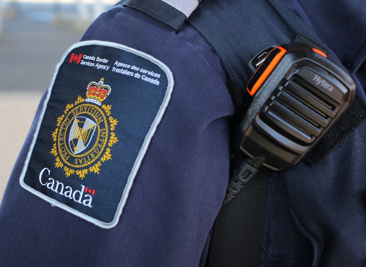 A Canada Border Service Agency officer.