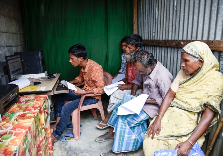 People checks their names in a roadside DTP centre, in the published final list of National Register of Citizens (NRC), in Morigaon district of Assam, India on 31 August 2019.