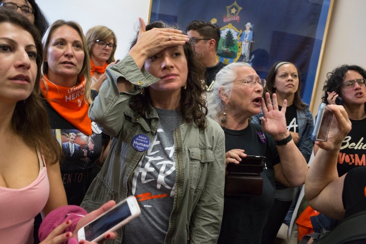Women's rights activists opposed to Brett Kavanaugh's nomination to the Supreme Court occupy Senator Susan Collins of Maine's