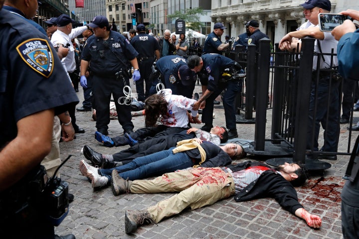 New York City Police arrest activists with the Extinction Rebellion movement as they demonstrate outside the New York Stock E