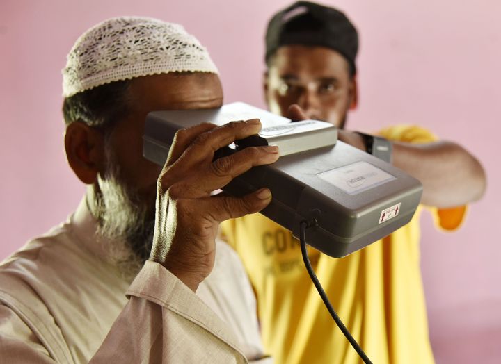A man takes an iris scan to link his Aadhar card with the National Register of Citizens (NRC) in Assam's Barpeta district on August 10, 2019.