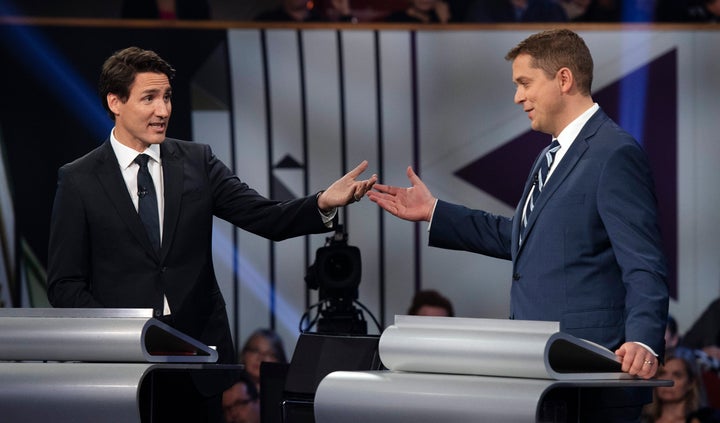 Conservative leader Andrew Scheer (right) and Prime Minister and Liberal leader Justin Trudeau gesture to each other as they both respond during the Federal Leaders Debate at the Canadian Museum of History in Gatineau, Que., Oct. 7.