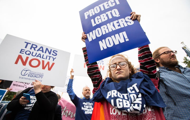 Activists gathered at the Supreme Court on Tuesday as the justices heard arguments on whether LGBTQ workers receive nondiscrimination protections under the Civil Rights Act.