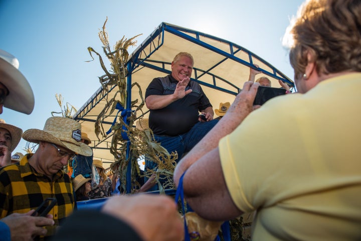 Ontario Premier Doug Ford welcomes visitors to the International Plowing Match in Verner, Ont. on Sept. 17, 2019.
