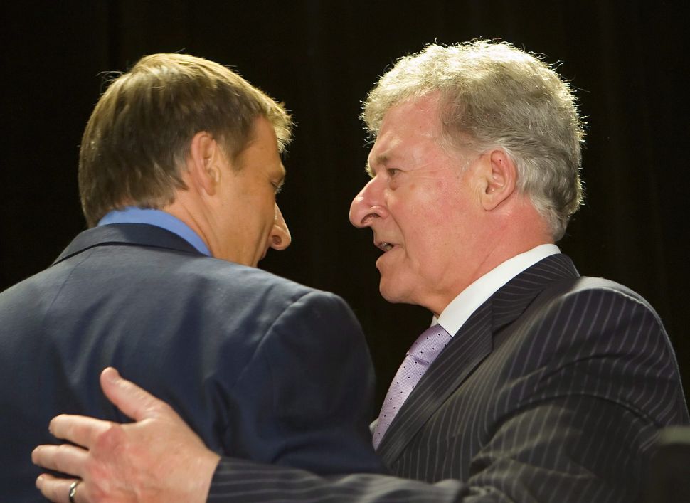 Maxime Bernier speaks with his father Gilles Bernier in St-Georges, south of Quebec City on June 25, 2008.