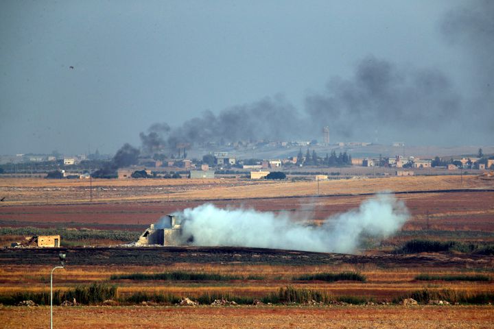 Smoke billows from targets inside Syria during bombardment by Turkish forces.