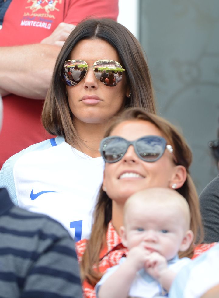 Rebecca Vardy stands behind Coleen Rooney at the Stade Bollaert-delelis for the England Vs. Wales Group B match in Lens France, in June 2016.