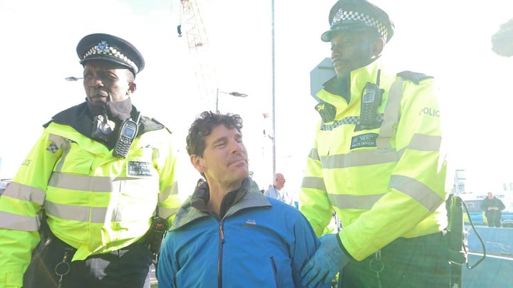 John Curran being arrested at London City Airport 