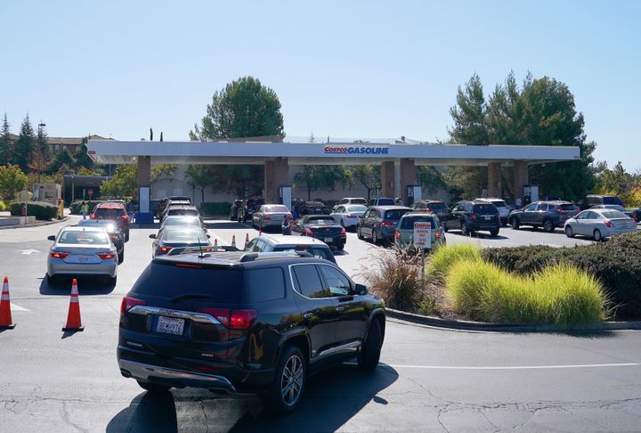 Cars line up to get gas at the Costco gas station in Vallejo, California, on Wednesday. PG&E plans on cutting power to hundreds of thousands of customers across central and northern California as a precaution.