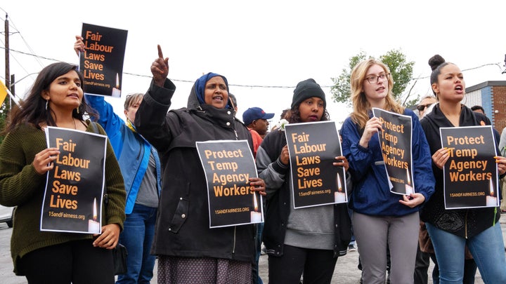 Demonstrators rally outside Fiera Foods in North York, Ont. after temporary worker Enrico Miranda died on the job.