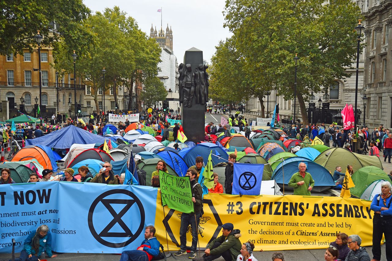 Extinction Rebellion (XR) protesters camp in tents around the Monument to the Women of World War II on Whitehall in Westminster, central London, as the climate change protest continued into a second day.