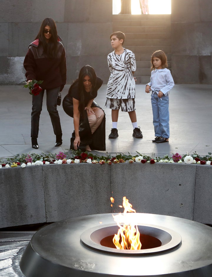 Reality TV personality Kim Kardashian and her sister Kourtney Kardashian with children visit the Armenian Genocide Memorial in Yerevan, Armenia on Tuesday.