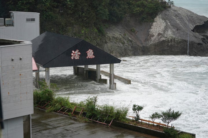 Surging waves comes into port over the breakwater while Typhoon Hagibis approaches in Kumano, Mie Prefecture, Japan Saturday, Oct. 12, 2019. (AP Photo/Toru Hanai)