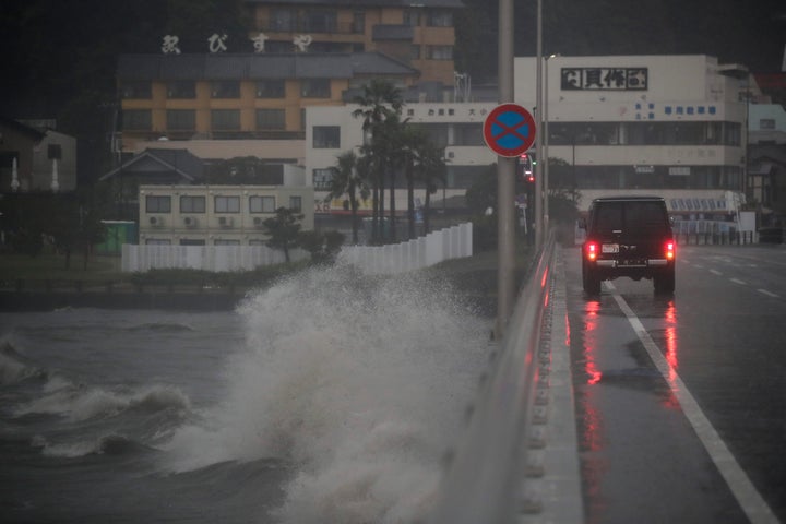 Waves crash against a bridge connecting to Enoshima Island, Saturday, Oct. 12, 2019, in Fujisawa, Japan, west of Tokyo. A powerful typhoon is forecast to bring up to 80 centimeters (30 inches) of rain and damaging winds to the Tokyo area and Japan's Pacific coast this weekend. (AP Photo/Jae C. Hong)