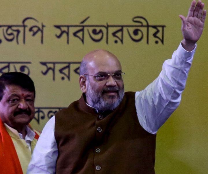 Indian Home Minister Amit Shah, waves to supporters in Kolkata, India, Tuesday, Oct. 1, 2019. Shah says that non-Muslim refugees will get citizenship before a controversial citizen registry has been finalized. The leader of Prime Minister Narendra Modi’s Hindu nationalist Bharatiya Janata Party, said Tuesday in Kolkata that the party would give “Hindu, Sikh, Buddhist, Jain and Christian settlers” citizenship. (AP Photo/Bikas Das)