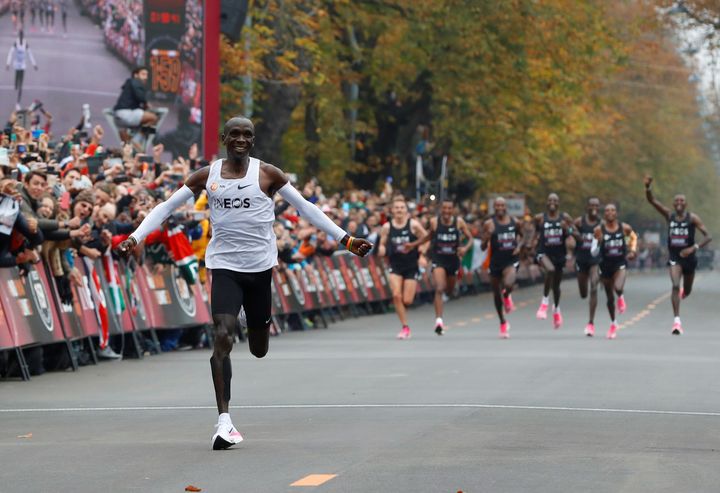 Kenya's Eliud Kipchoge, the marathon world record holder, crosses the finish line during his attempt to run a marathon in under two hours in Vienna, Austria, October 12, 2019. REUTERS/Leonhard Foeger