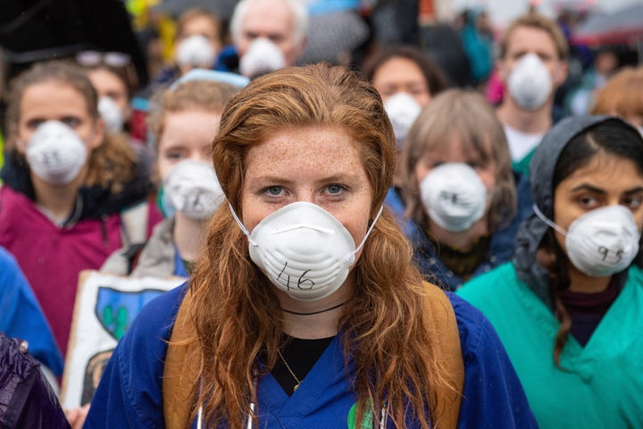 Doctors gather to protest in support of Extinction Rebellion (XR) at Jubilee Gardens, London, to highlight deaths caused by air pollution.