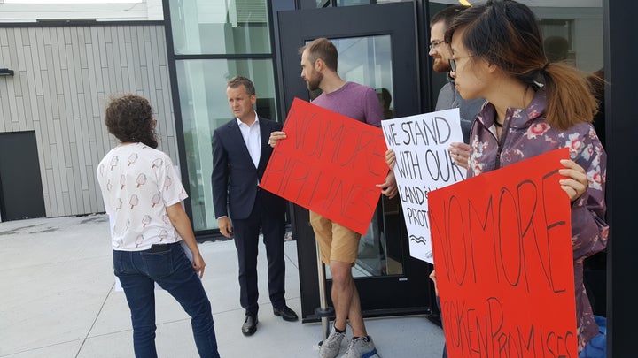 Indigenous Services Minister Seamus O'Regan is confronted by protesters outside a Liberal fundraiser at Memorial University's Signal Hall campus in St. John's on Aug. 6, 2019.