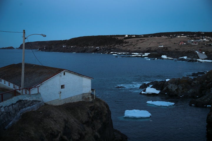 Small icebergs float off the water in Pouch Cove, N.L. at dusk on April 25, 2017.