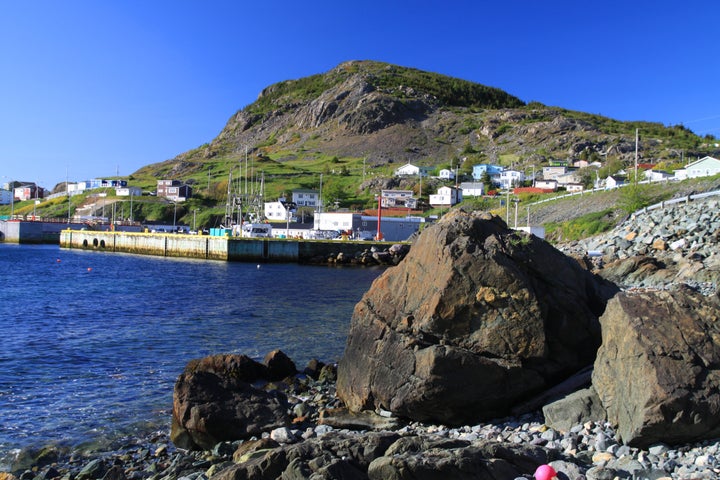 File photo of the shore in Portugal Cove, N.L. Homes are strewn along the hillside. Wharf has ferry to Bell Island.