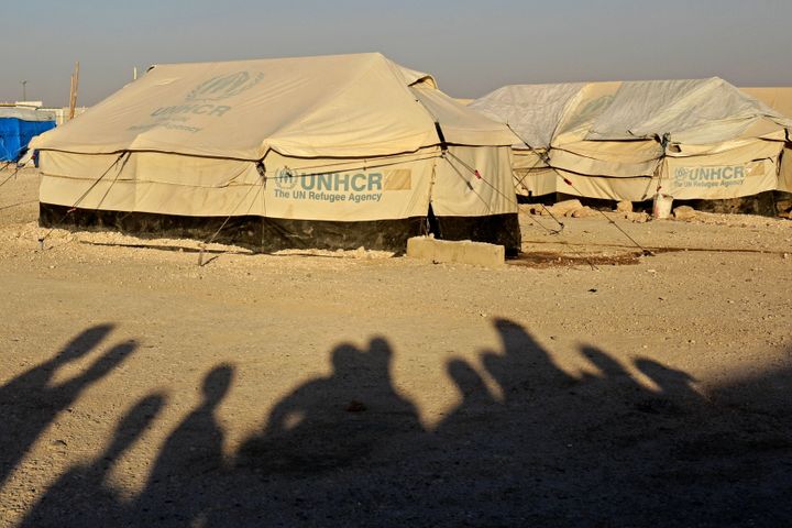 The shadows of displaced people photographed at Ain Issa in 2018. 