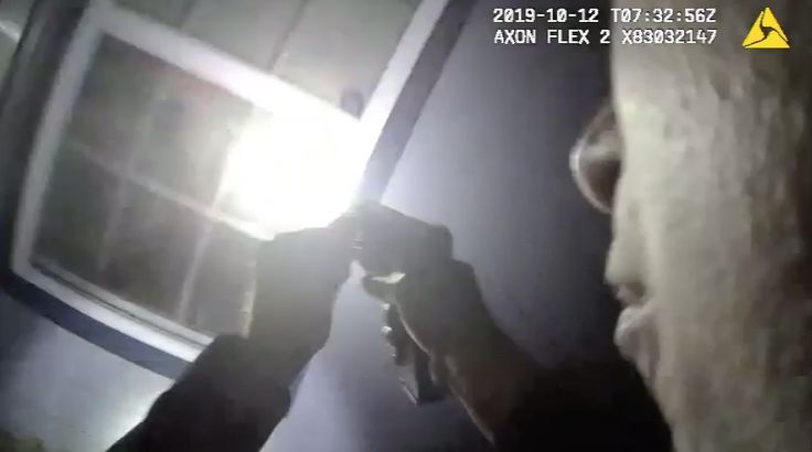 Body camera footage shows a Fort Worth police officer appearing to aim a gun into the house of Atatiana Jefferson, who was shot and killed by police in her own home Saturday.