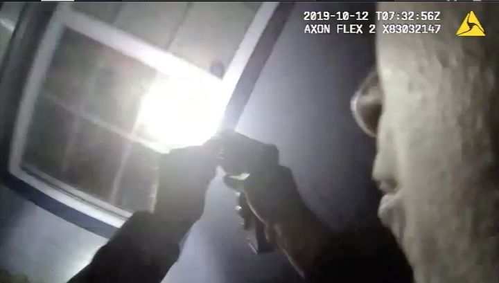 Body camera footage shows a Fort Worth police officer aiming a gun into the house of Atatiana Jefferson, who was shot and killed by police in her own home Saturday.