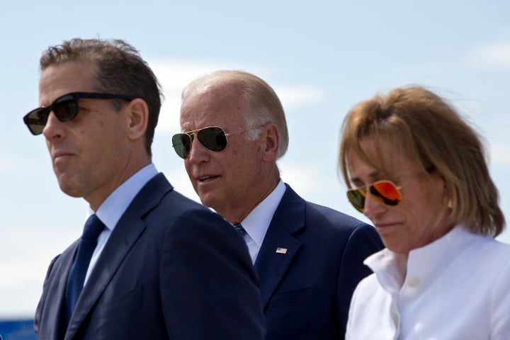 Family members gather for a road naming ceremony with then-Vice President Joe Biden, center, his son Hunter Biden, left, and his sister Valerie Biden Owens, right, joined by other family members during a ceremony to name a national road after his late son Joseph R. "Beau" Biden III, in the village of Sojevo, Kosovo, on Wednesday, Aug. 17, 2016. (AP Photo/Visar Kryeziu)