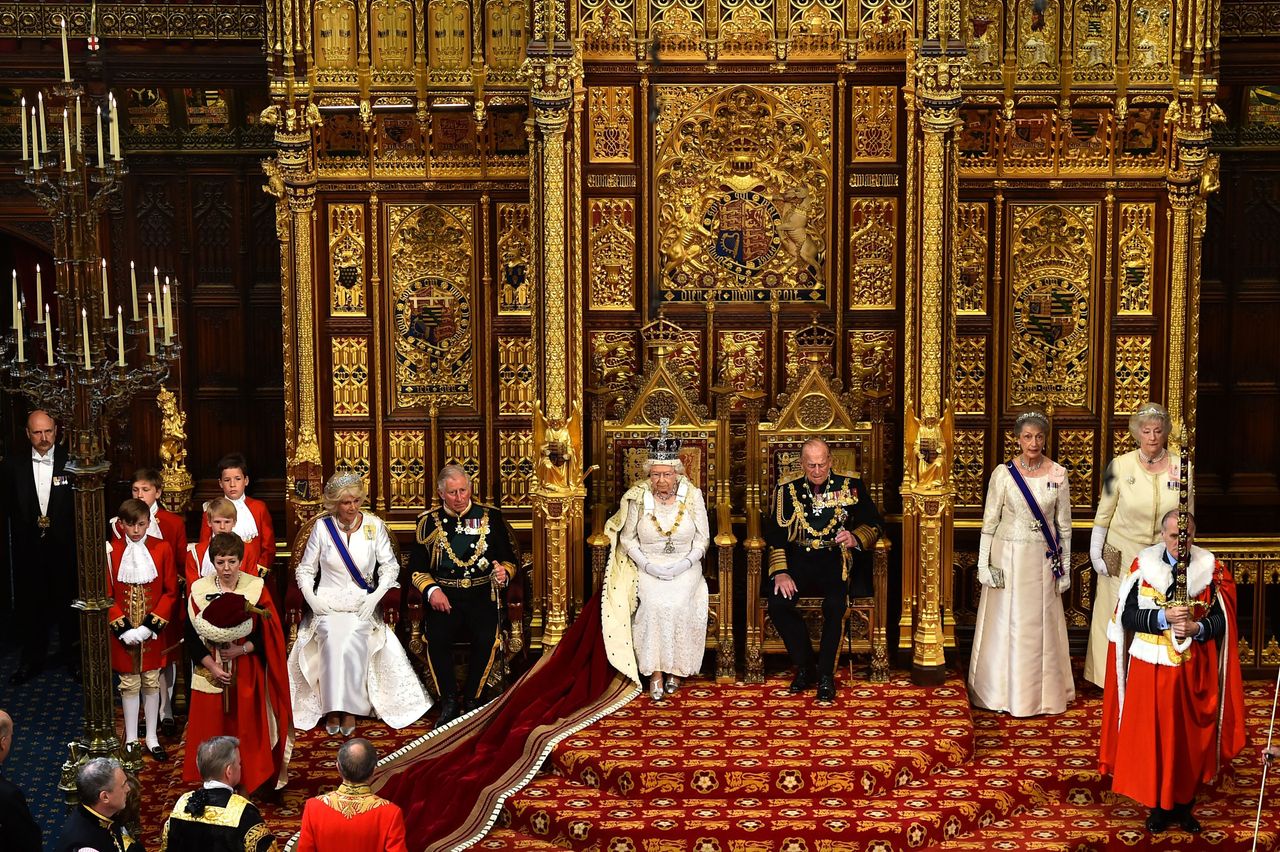 The Queen sat on the throne in the House of Lords next to Prince Philip, Prince Charles and the Duchess of Cornwall 