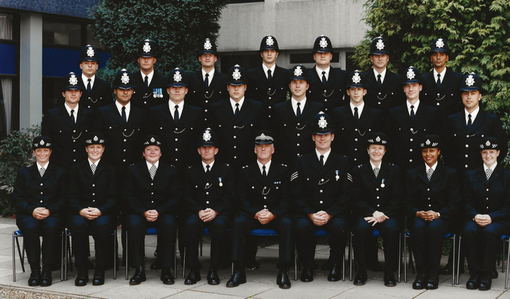 John Curran (middle row, second from right) pictured on the day of his graduation from police training.