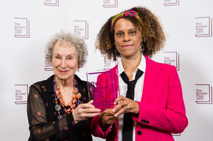 Joint winners Margaret Atwood, left, and c, right, pose with their 2019 Booker Prize Winner on Oct. 14, 2019, in London, England. 
