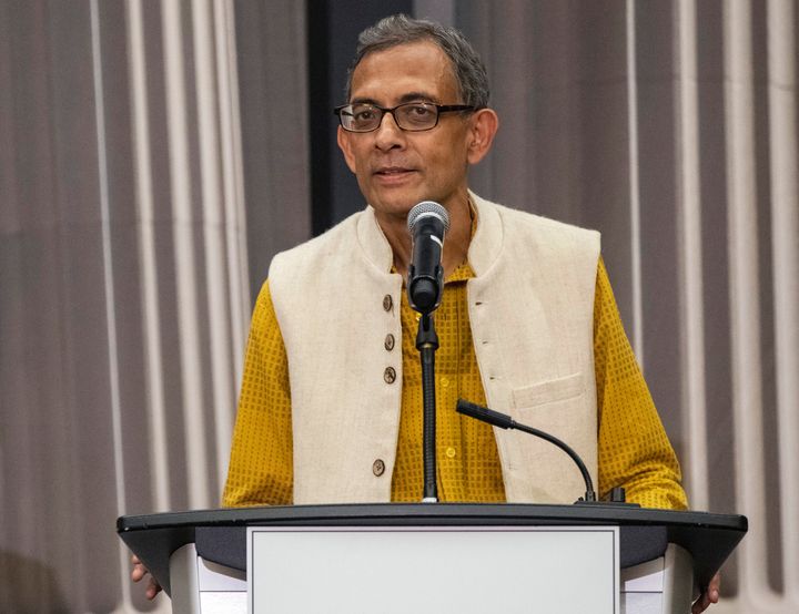 Abhijit Banerjee, right, talks during a news conference with Esther Duflo at Massachusetts Institute of Technology in Cambridge, Mass., Monday, Oct. 14, 2019. 