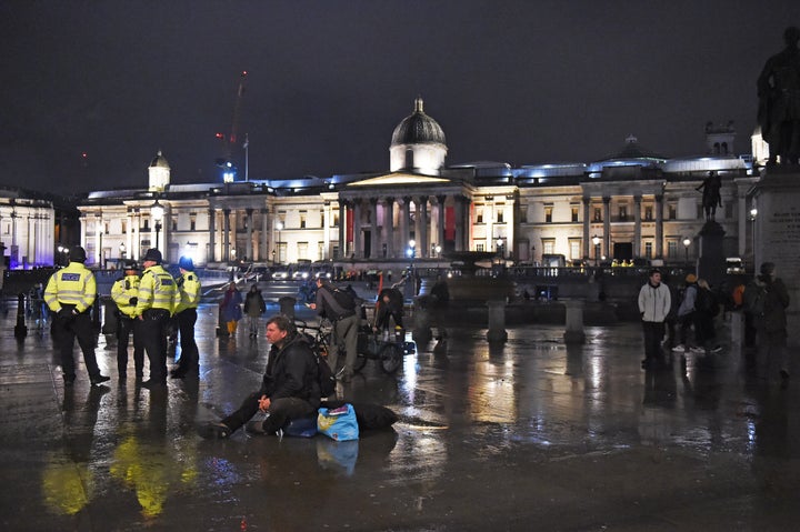 <strong>Police work to remove Extinction Rebellion protesters in Trafalgar Square, central London last night.</strong>