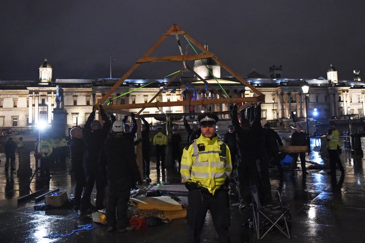 <strong>Police remove an Extinction Rebellion structure from Trafalgar Square, central London. </strong>