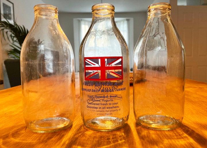 Empty milk bottles ready to be collected.