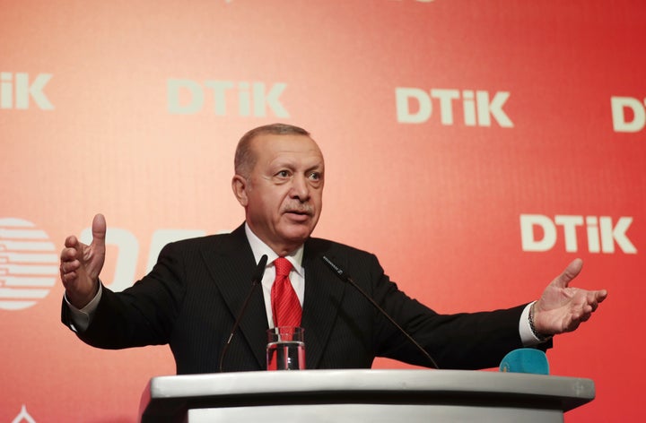 Turkey's President Recep Tayyip Erdogan addresses the World Turkish Business Council meeting, in Baku, Azerbaijan, Monday. Oct. 14, 2019. Erdogan says Turkey's military offensive into northeast Syria is as "vital" to Turkey as its 1974 military intervention in Cyprus, which split the island in two.