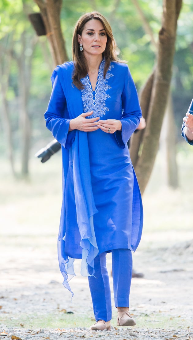 The duchess wears an embroidered blue shalwar kameez by Pakistani designer Maheen