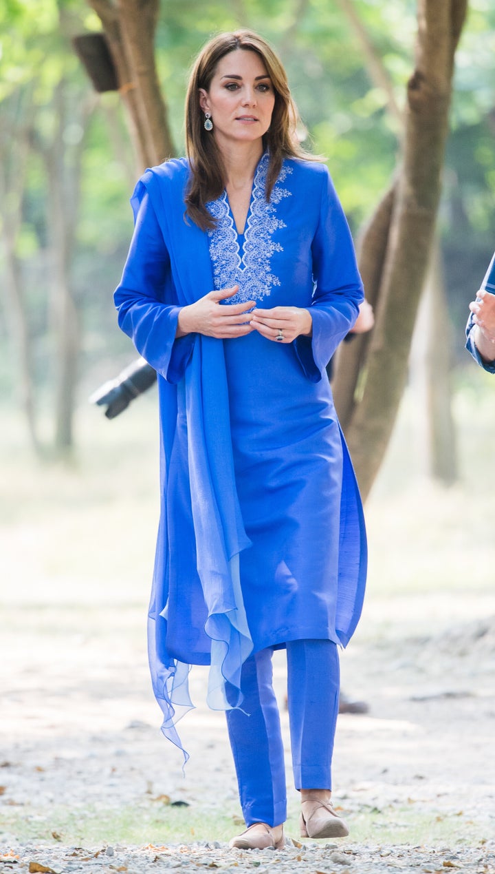 The duchess wears an embroidered blue shalwar kameez by Pakistani designer Maheen Khan.