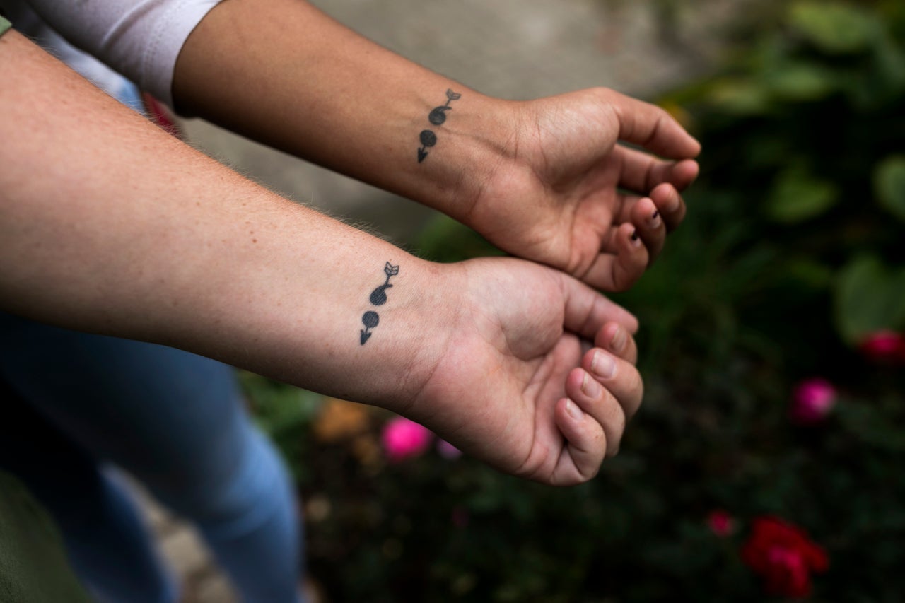 Bresha Meadows and her mother Brandi Meadows show their matching semicolon tattoos.