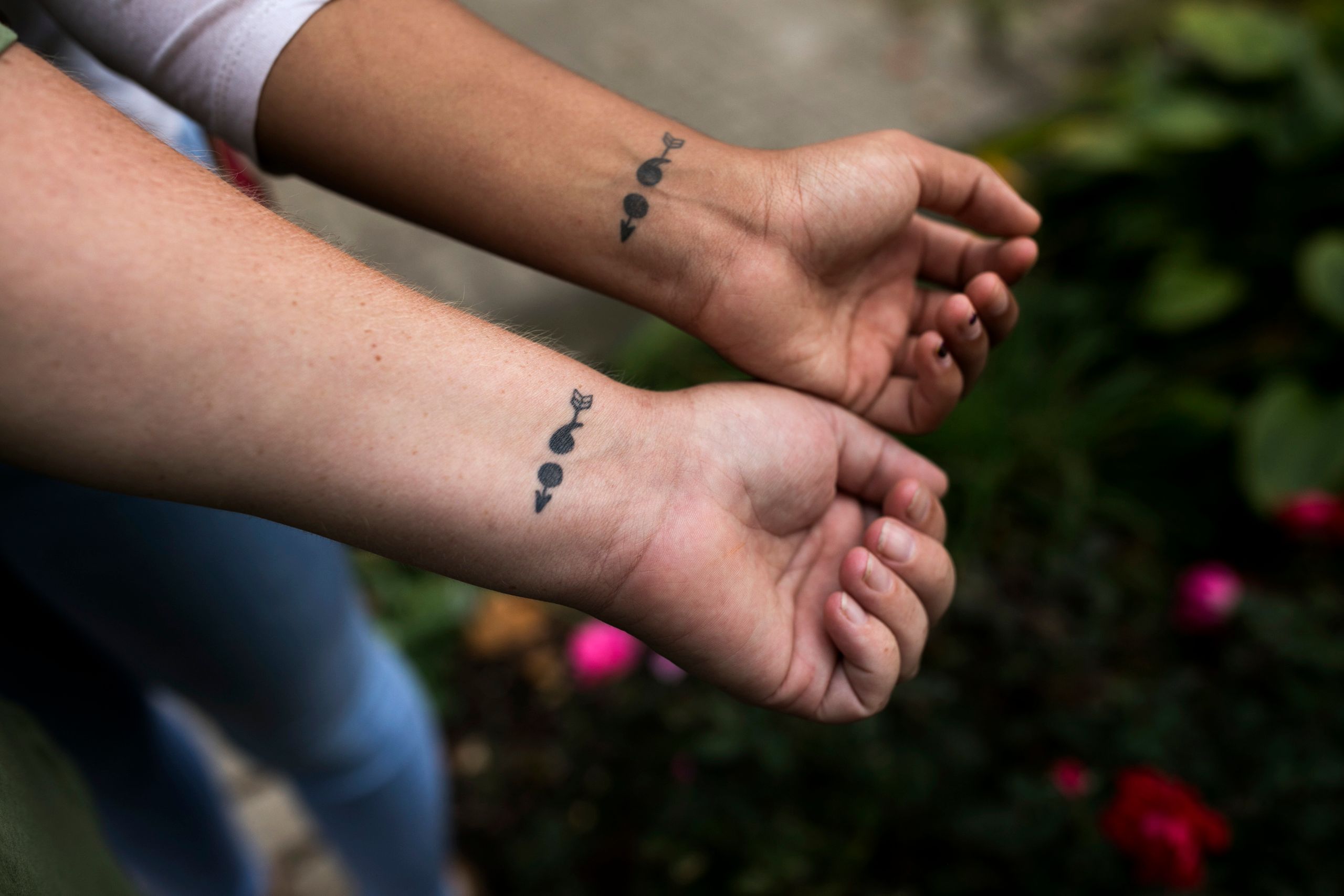 Bresha Meadows and her mother Brandi Meadows show their matching semicolon tattoos.