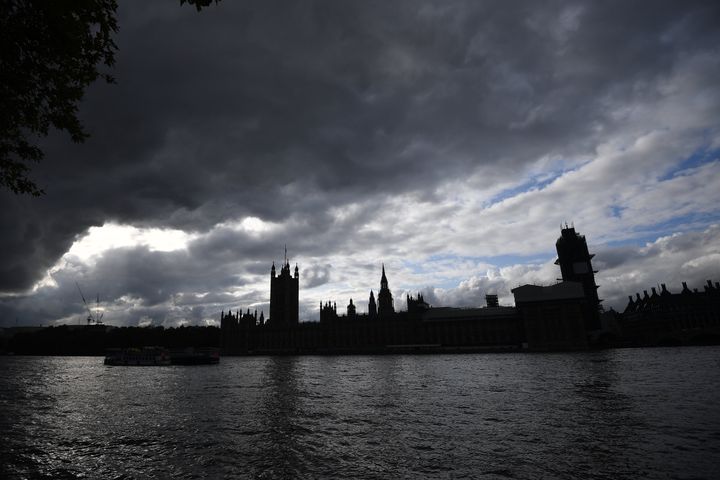 General view of the Palace of Westminster in shadow as dark clouds gather over Parliament.