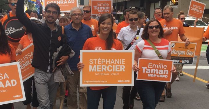 In this file photo, NDP candidate Stéphanie Mercier, centre, marches with supporters in downtown Ottawa.