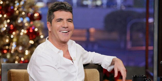THE TONIGHT SHOW WITH JAY LENO -- Episode 4578 -- Pictured: Simon Cowell during an interview on December 9, 2013 -- (Photo by: Paul Drinkwater/NBC/NBCU Photo Bank via Getty Images)