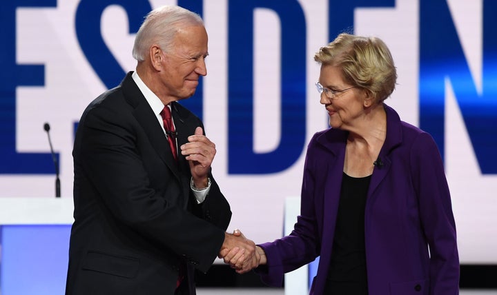 Former Vice President Joe Biden and Sen. Elizabeth Warren shake hands ahead of the fourth Democratic primary debate Tuesday at Otterbein University in Westerville, Ohio.