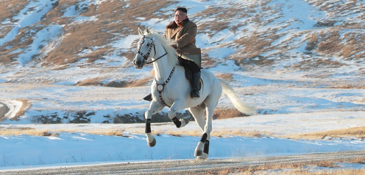 North Korean leader Kim Jong Un rides a horse during snowfall in Mount Paektu in this image released by North Korea's Korean