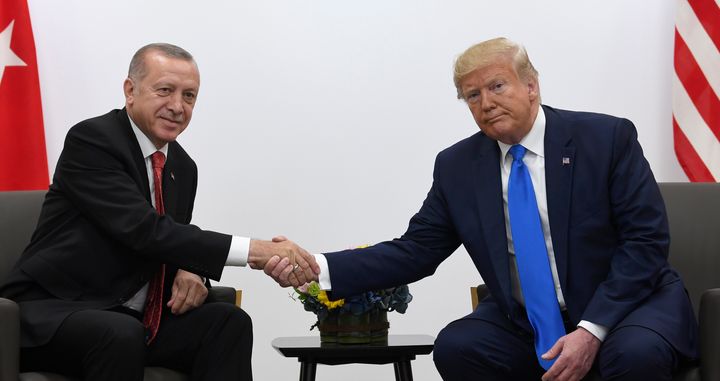 President Donald Trump, right, shakes hands with Turkish President Recep Tayyip Erdogan, left, during a meeting on the sidelines of the G-20 summit in Osaka, Japan, Saturday, June 29, 2019. (AP Photo/Susan Walsh)