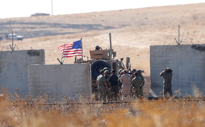 Turkish and US troops meet on the Turkish-Syrian border for a joint US-Turkey patrol in northern Syria last month.